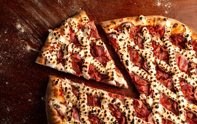 Pepperoni Lover pizza stacked with pepperoni slices