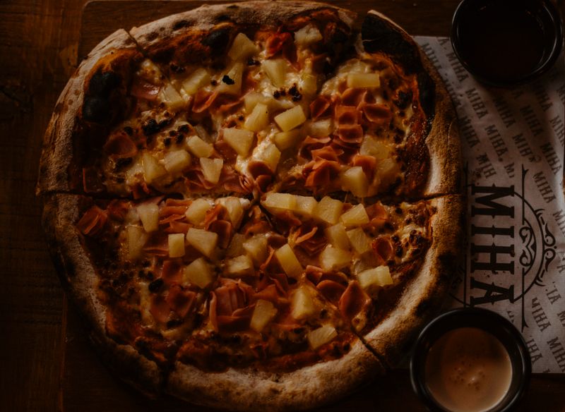 Four Cheese pizza with mozzarella, cheddar, gorgonzola, and parmesan